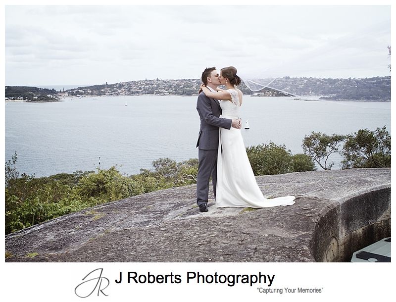 Couple kissing with flyaway veil at Georges Heights Mosman - sydney wedding photography 